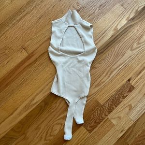 Sexy Beige turtleneck bodysuit with cut out back